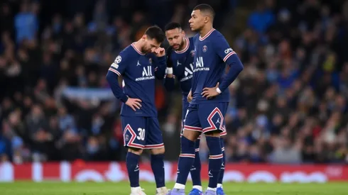 Kylian Mbappe of Paris Saint-Germain reacts as teammates Lionel Messi and Neymar talk in the background after Manchester City's first goal during the UEFA Champions League
