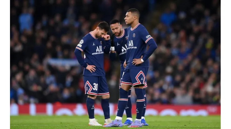 Kylian Mbappe of Paris Saint-Germain reacts as teammates Lionel Messi and Neymar talk in the background after Manchester City's first goal during the UEFA Champions League