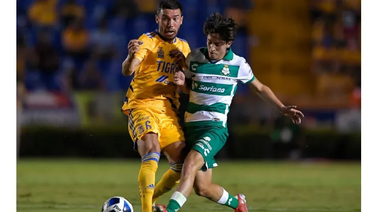 Juan Vigon of Tigres UANL (left) tries to steal the ball from Jordan Carrillo of Santos Laguna