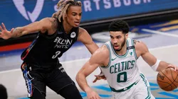 Nicolas Claxton of Nets (left) tries to block Jayson Tatum of Celtics