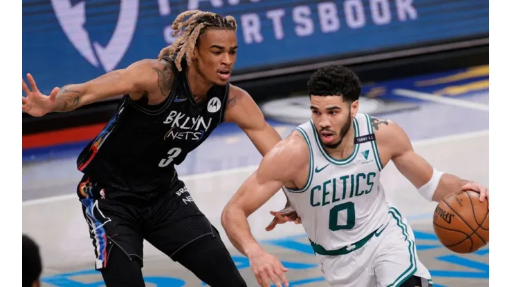 Nicolas Claxton of Nets (left) tries to block Jayson Tatum of Celtics