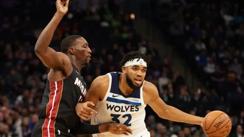Bam Adebayo of Miami Heat (left) tries to block a shot from Karl-Anthony Towns of Minnesota Timberwolves