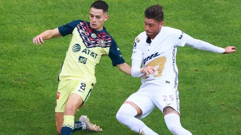 Alvaro Fidalgo of Club America (left) against Arturo Ortiz of Pumas UNAM.
