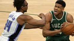 Wendell Carter Jr of Orlando Magic (left) triest to stop Giannis Antetokounmpo