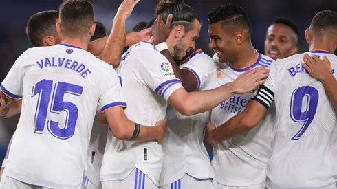 Real Madrid players celebrate after scoring