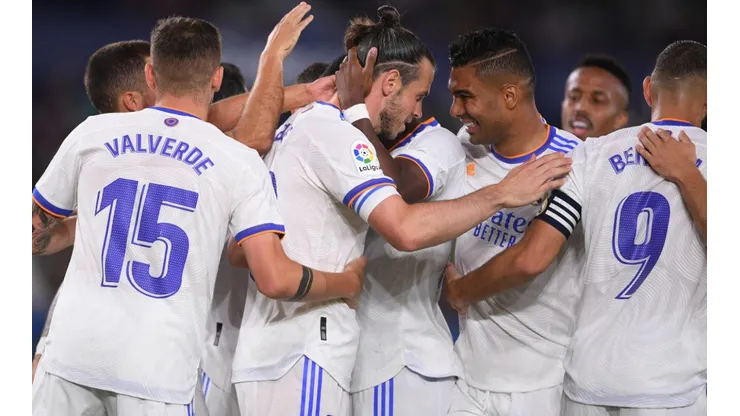 Real Madrid players celebrate after scoring