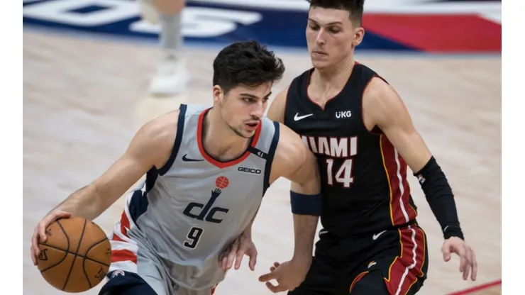 Deni Avdija of Washington Wizards (left) tries to avoid Tyler Herro of Miami Heat