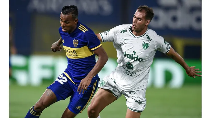 Sebastian Villa of Boca Juniors (left) against Nicolas Bazzana of Sarmiento.
