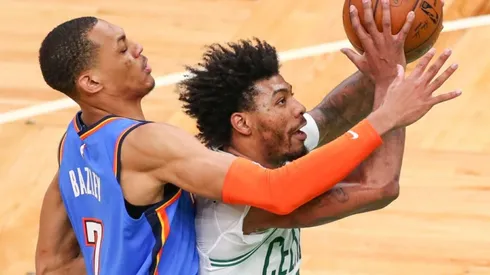 Darius Bazley of Oklahoma City Thunder (left) tries to block a shot of Marcus Smart of Boston Celtics