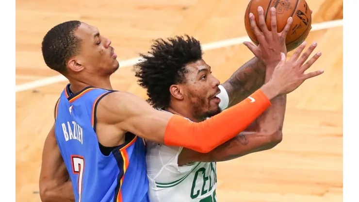 Darius Bazley of Oklahoma City Thunder (left) tries to block a shot of Marcus Smart of Boston Celtics