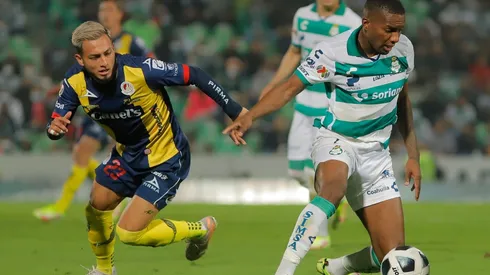 Juan Otero of Santos Laguna (right) protects the ball against Jose Hernandez of San Luis.