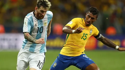 Lionel Messi of Argentina (left) against Paulinho of Brazil during a World Cup Qualifier in 2016.