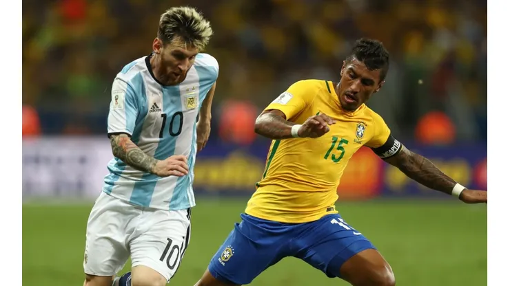 Lionel Messi of Argentina (left) against Paulinho of Brazil during a World Cup Qualifier in 2016.