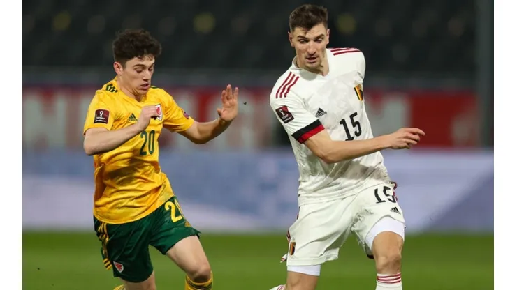 Thomas Meunier of Belgium (left) tries to avoid defender Daniel James of Wales
