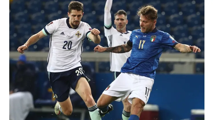 Ciro Immobile of Italy (right) and Craig Cathcart of Northern Ireland (left)