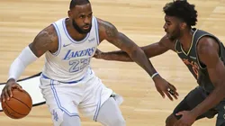 LeBron James of Lakers (left) tries to avoid defender Patrick Williams of the Bulls