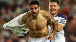 Aleksandar Mitrovic (left) of Serbia celebrates after scoring