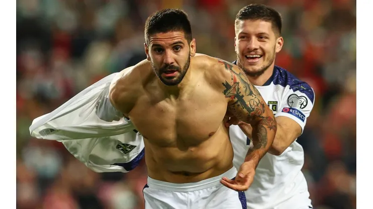 Aleksandar Mitrovic (left) of Serbia celebrates after scoring