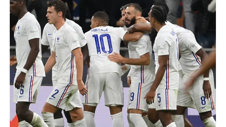 Karim Benzema of France (center) is congratulated by teammates