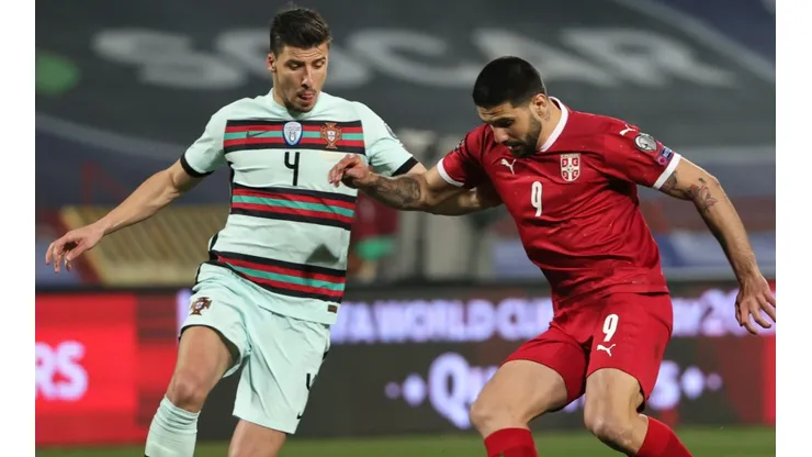 Ruben Dias of Portugal (left) and Aleksandar Mitrovic of Serbia (right)