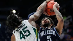 Davion Mitchell of the Baylor Bears (left) blocks a shot from Justin Moore of Villanova Wildcats