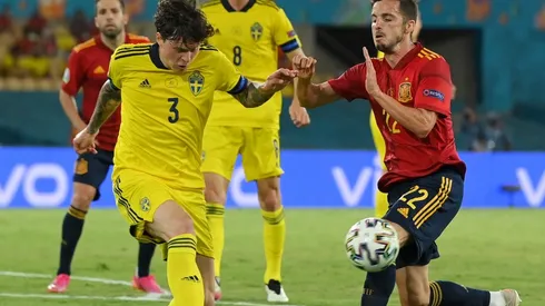 Victor Lindelof of Sweden (left) and Pablo Sarabia of Spain (right)