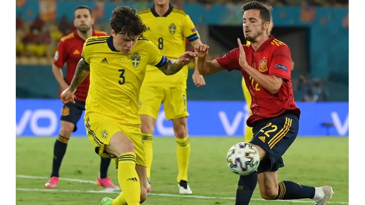 Victor Lindelof of Sweden (left) and Pablo Sarabia of Spain (right)
