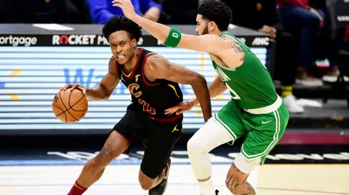 Collin Sexton of Cavaliers (left) tries to drive away from Jayson Tatum of Celtics