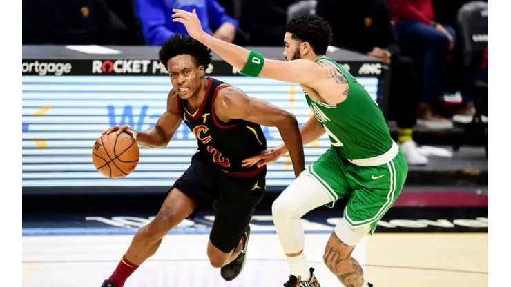 Collin Sexton of Cavaliers (left) tries to drive away from Jayson Tatum of Celtics