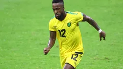 Junior Flemmings of Jamaica drives the ball.