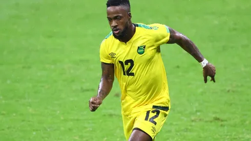 Junior Flemmings of Jamaica drives the ball.
