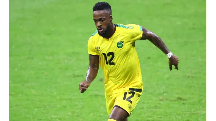 Junior Flemmings of Jamaica drives the ball.