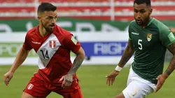 Gabriel Costa Heredia of Peru and Adrian Jusino of Bolivia fight for the ball.