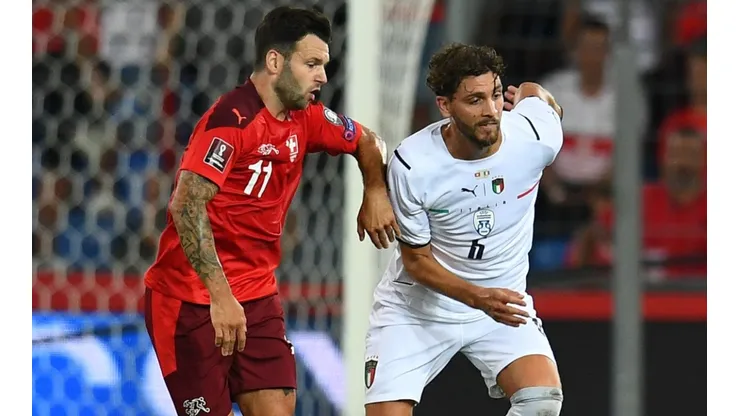 Manuel Locatelli of Italy (right) and Renato Steffen of Switzerland (left)
