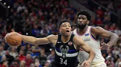 Giannis Antetokounmpo of Milwaukee Bucks (left) tries to pass drible Joel Embiid of Philadelphia 76ers