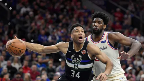 Giannis Antetokounmpo of Milwaukee Bucks (left) tries to pass drible Joel Embiid of Philadelphia 76ers