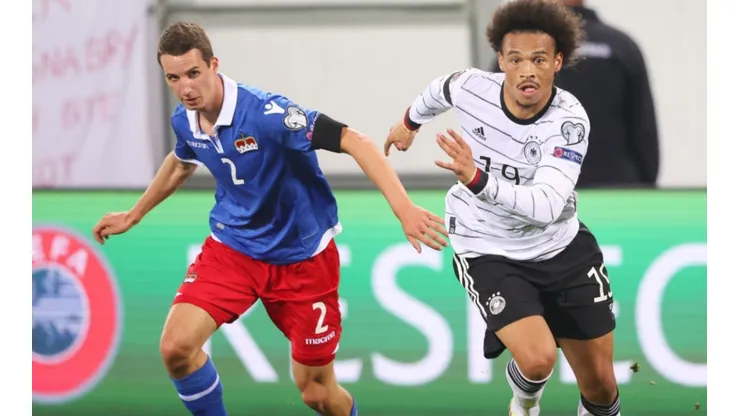 Rafael Grunenfelder of Liechtenstein (left) tries to stop Leroy Sane of Germany