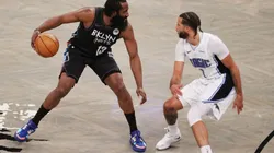 James Harden of the Nets (left) tries to pass drible Michael Carter-Williams of the Magic