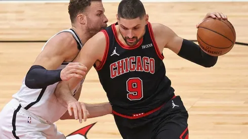 Blake Griffin of Nets (left) tries to stop Nikola Vucevic of Chicago Bulls
