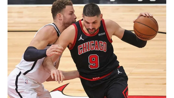 Blake Griffin of Nets (left) tries to stop Nikola Vucevic of Chicago Bulls
