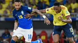 Neymar of Brazil (left) against Yerry Mina of Colombia.