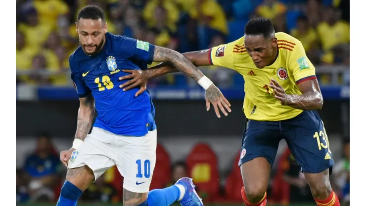 Neymar of Brazil (left) against Yerry Mina of Colombia.
