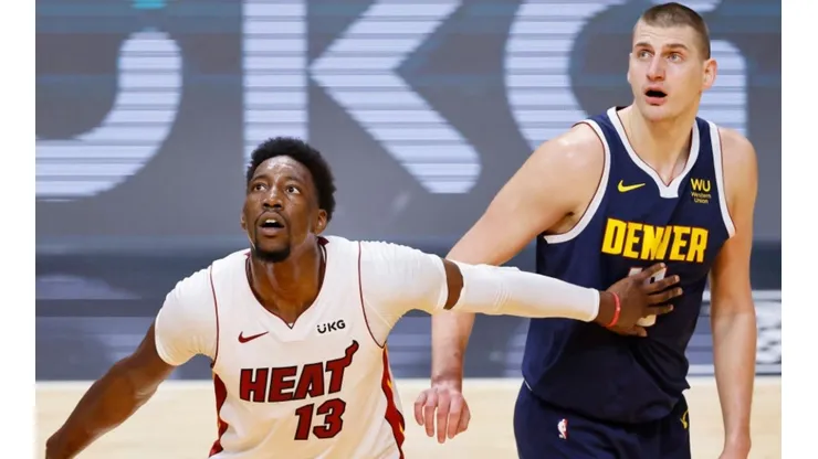 Bam Adebayo of Miami Heat (left) tries to avoid a offensive rebound against Nikola Jokic