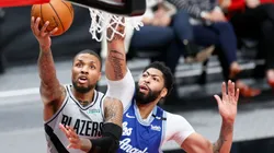 Damian Lillidard of Portland (left) tries to score in front of Anthony Davis of Los Angeles