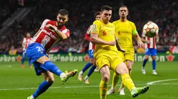 Yannick Carrasco of Atletico de Madrid competes for the ball with James Milner of Liverpool FC during the UEFA Champions League group B match