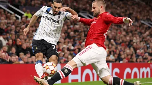 Davide Zappacosta of Atalanta (left) tries to avoid defender Luke Shaw of Manchester United