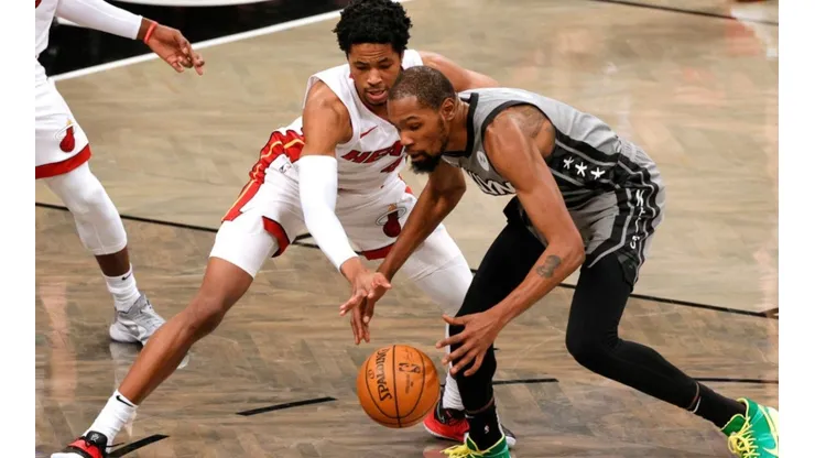 KZ Okpala of Miami Heat (left) and Kevin Durant of the Nets