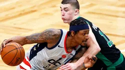 Bradley Beal of the Wizards (left) tries to pass around Payton Pritchard of the Celtics
