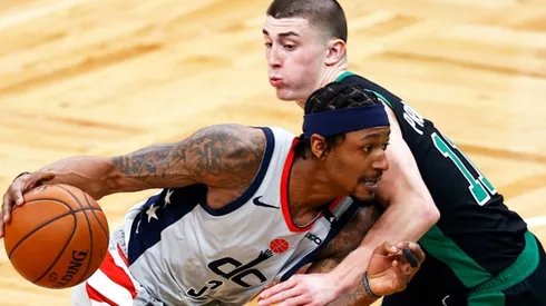 Bradley Beal of the Wizards (left) tries to pass around Payton Pritchard of the Celtics
