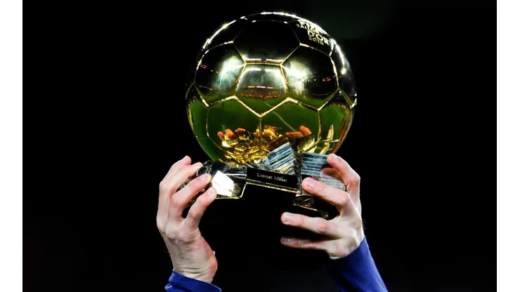 Lionel Messi holding the Ballon d'Or in 2016.